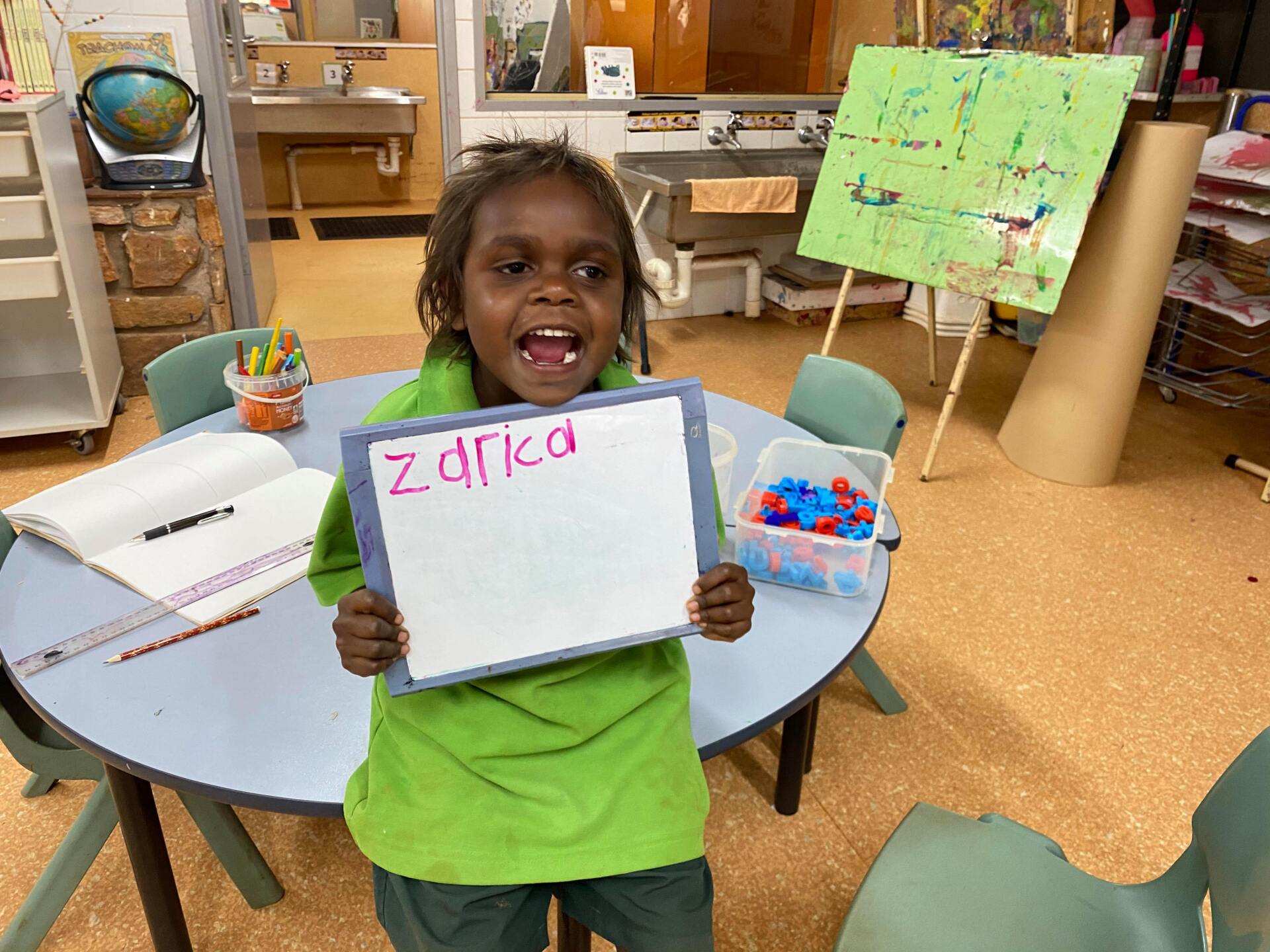 Student showing their writing of their name