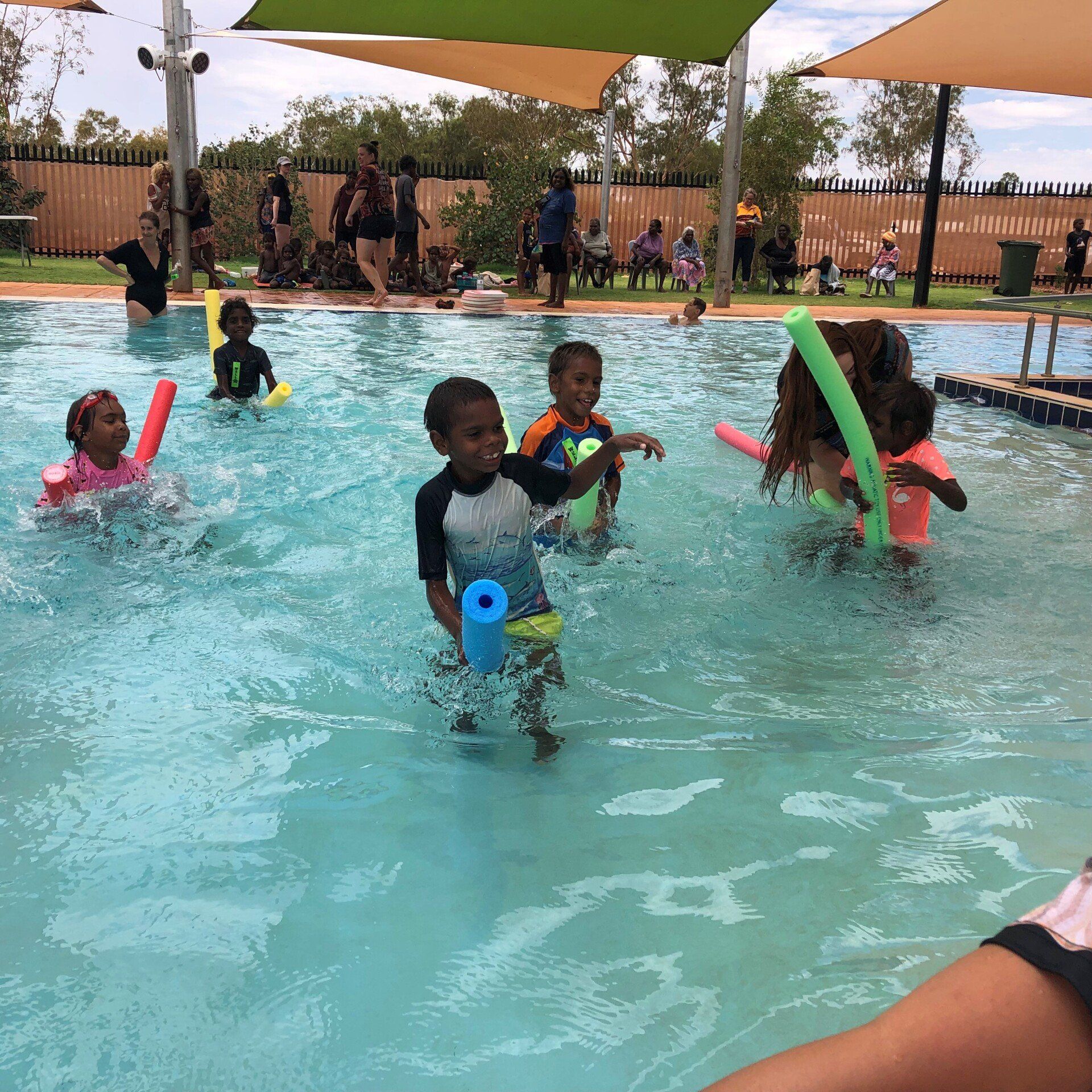 Students participating in swimming race