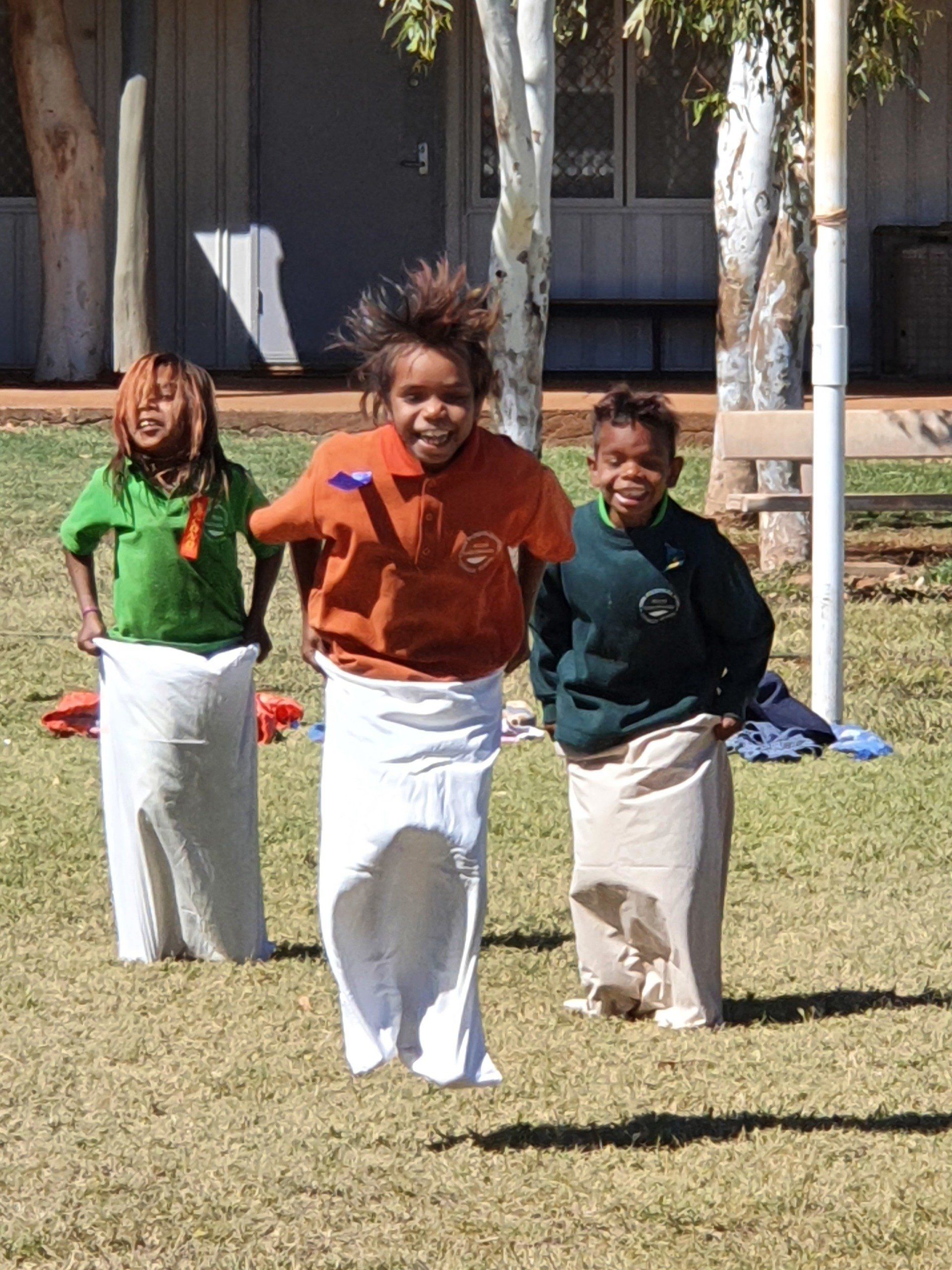JPP Mulan students jumping in mail bags