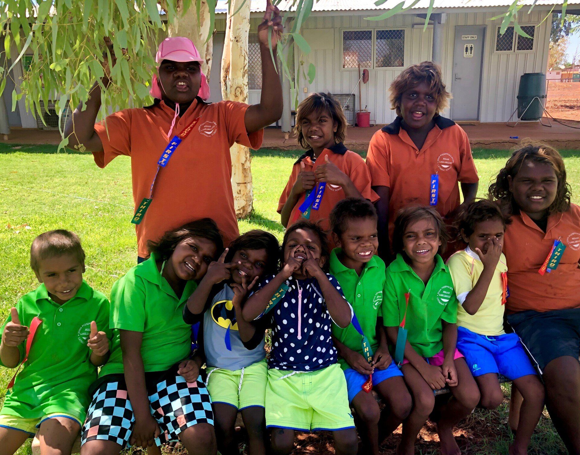 Group of students smiling at the camera on NAIDOC day