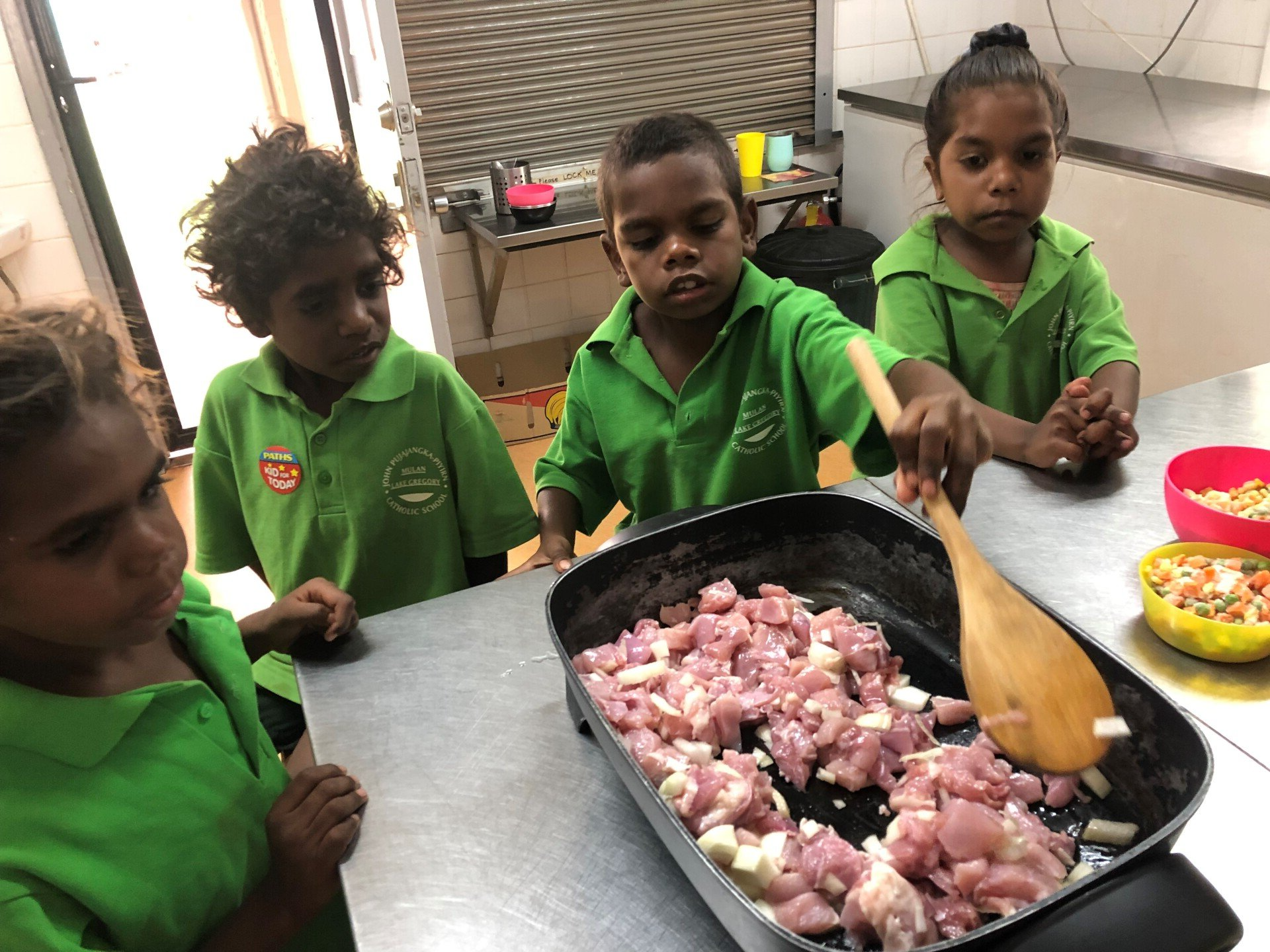 Students cooking in kitchen