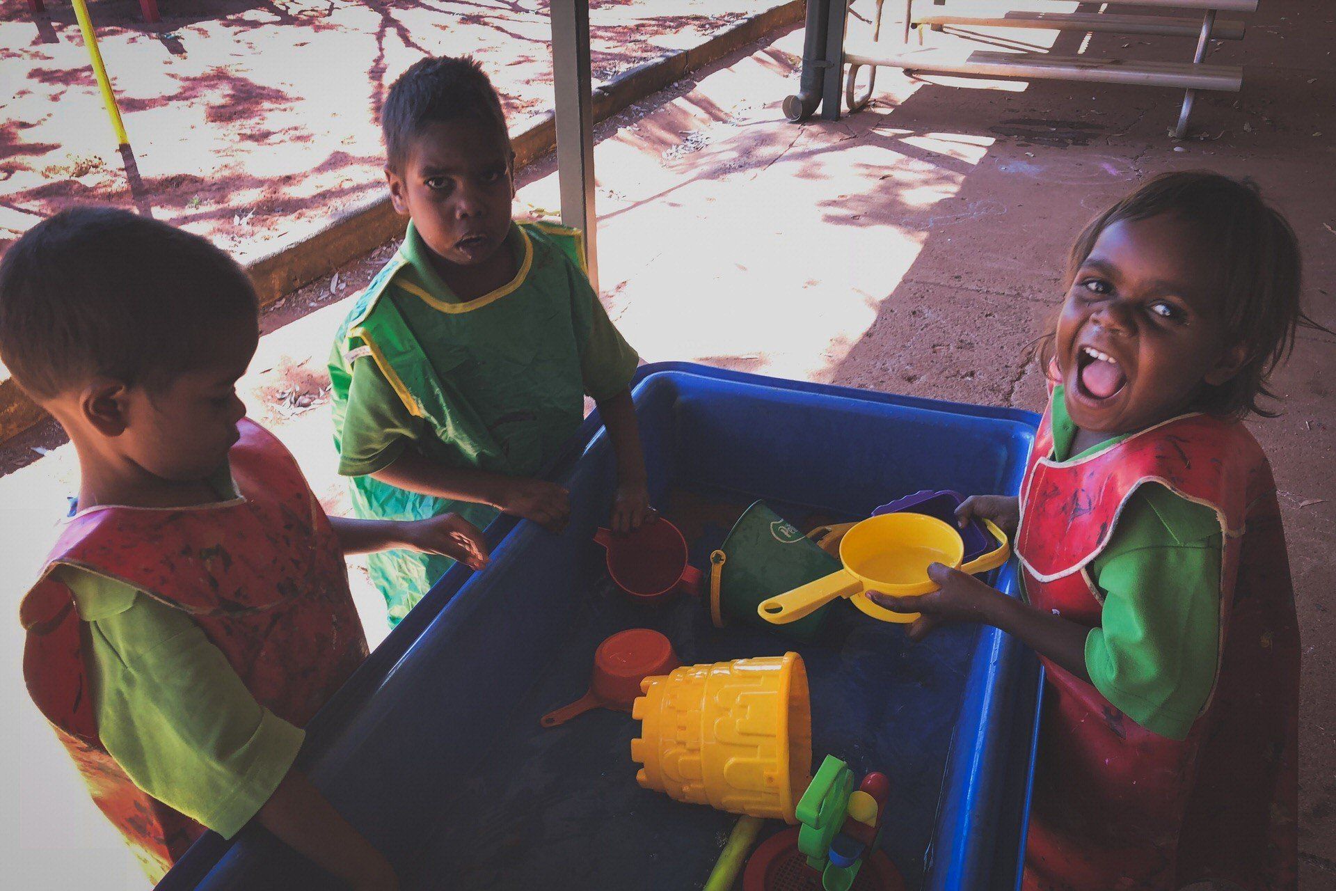 Kindy aged JPP School students playing with water