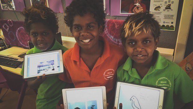 JPP School students showing off their drawings on ipads