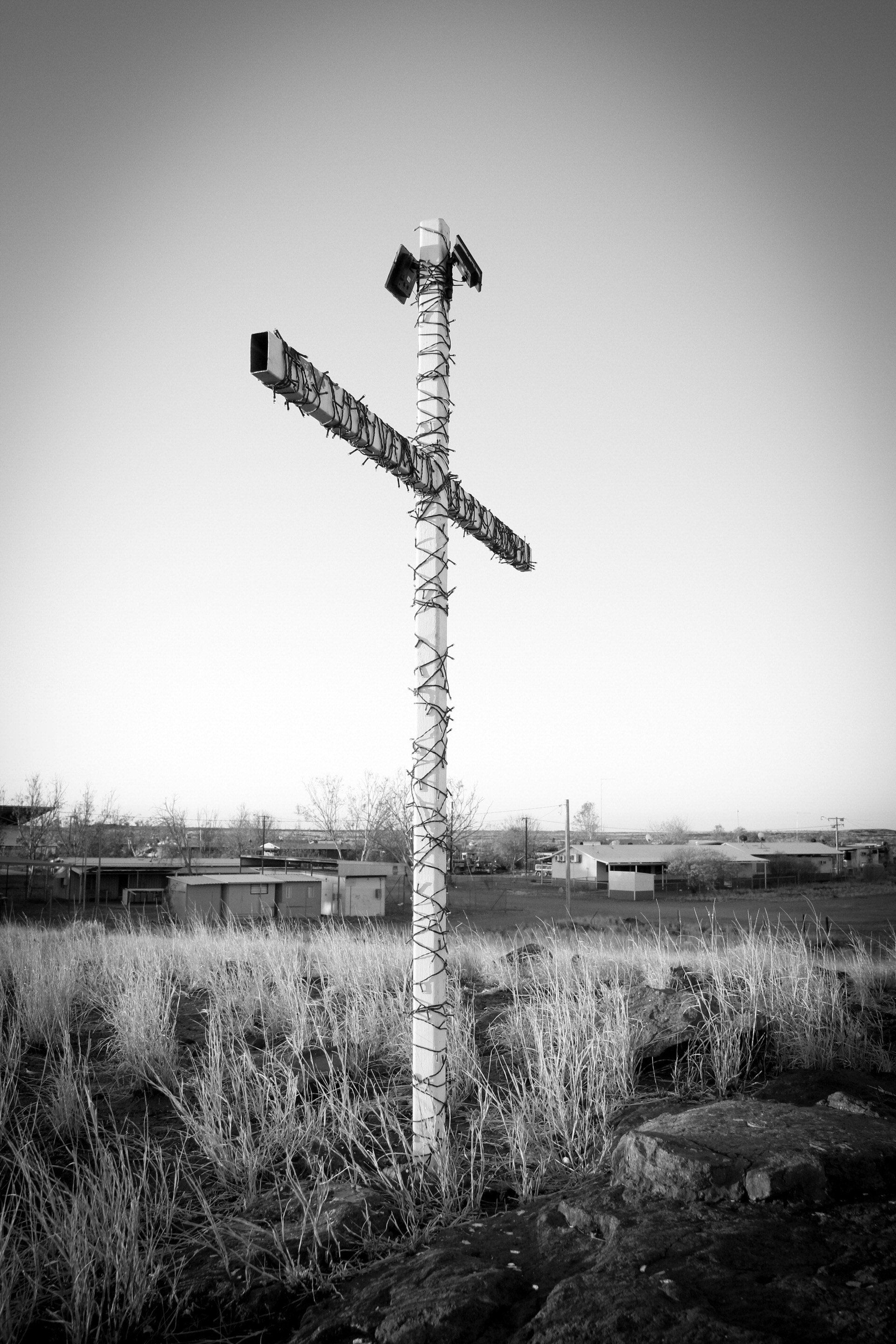 A simple white holy cross at the Mulan Aboriginal Community