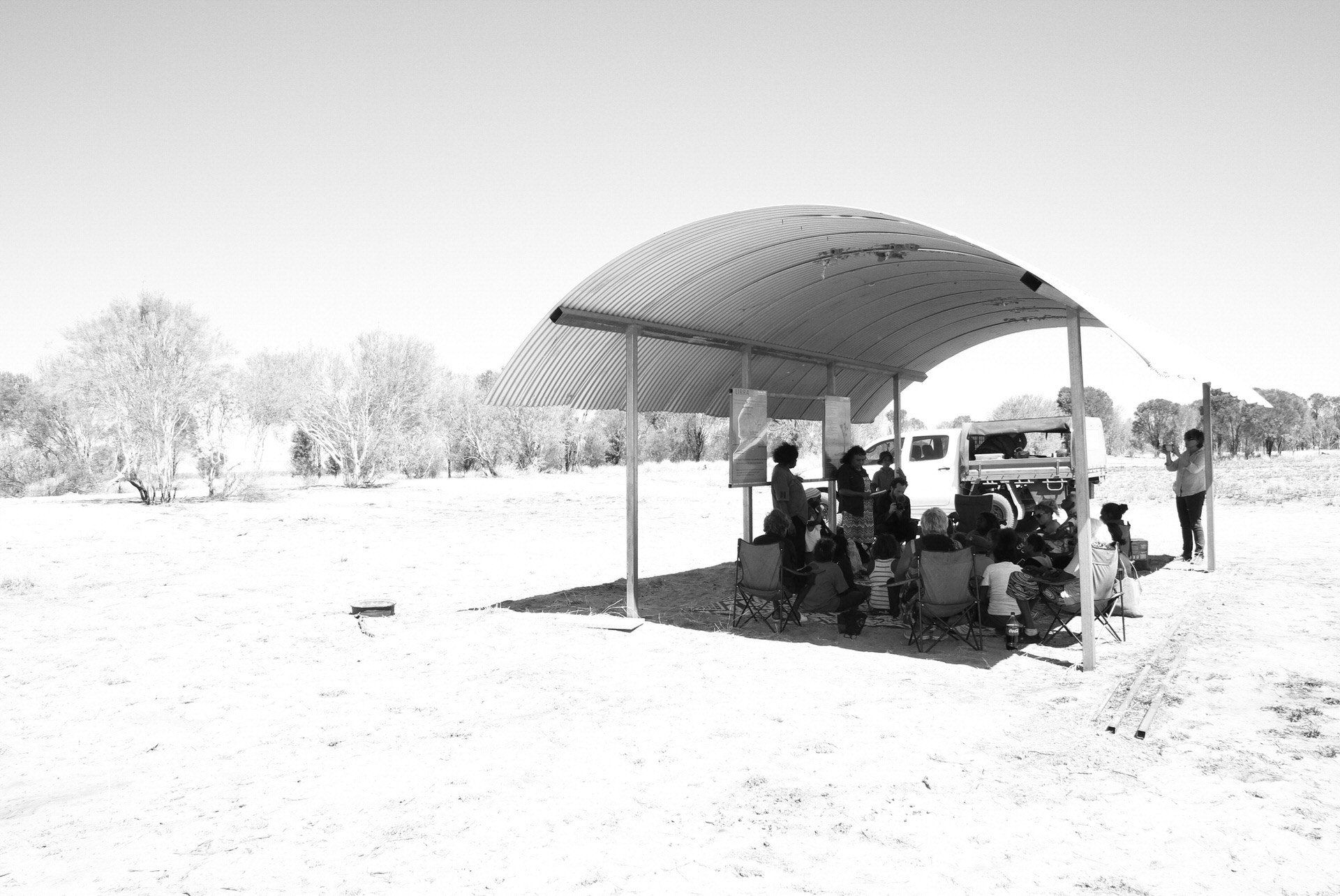 JPP School students and community elders at an information shelter