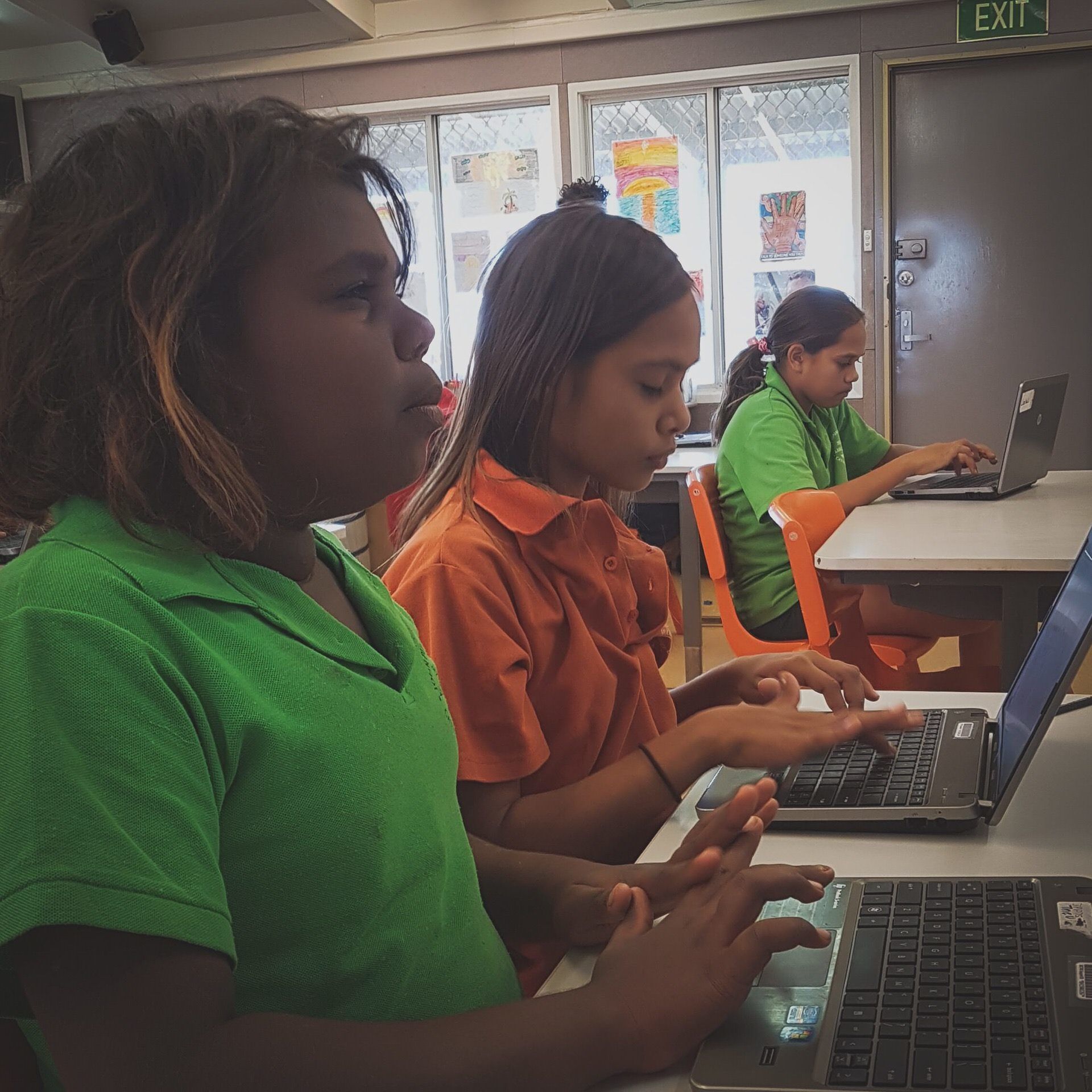 JPP School students working on laptops
