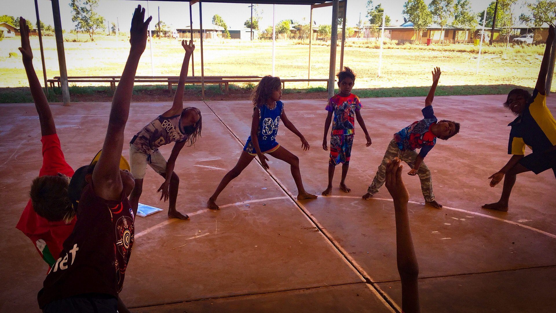 JPP School students exercising outside on basketball court