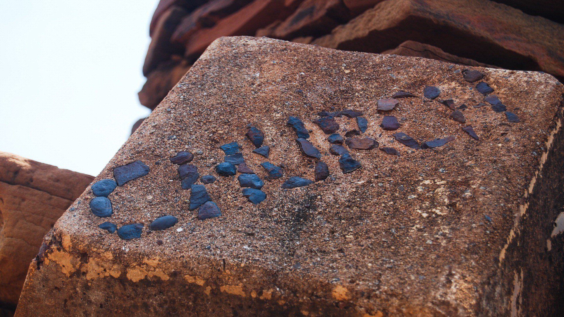 The word church made from stones set in concret block