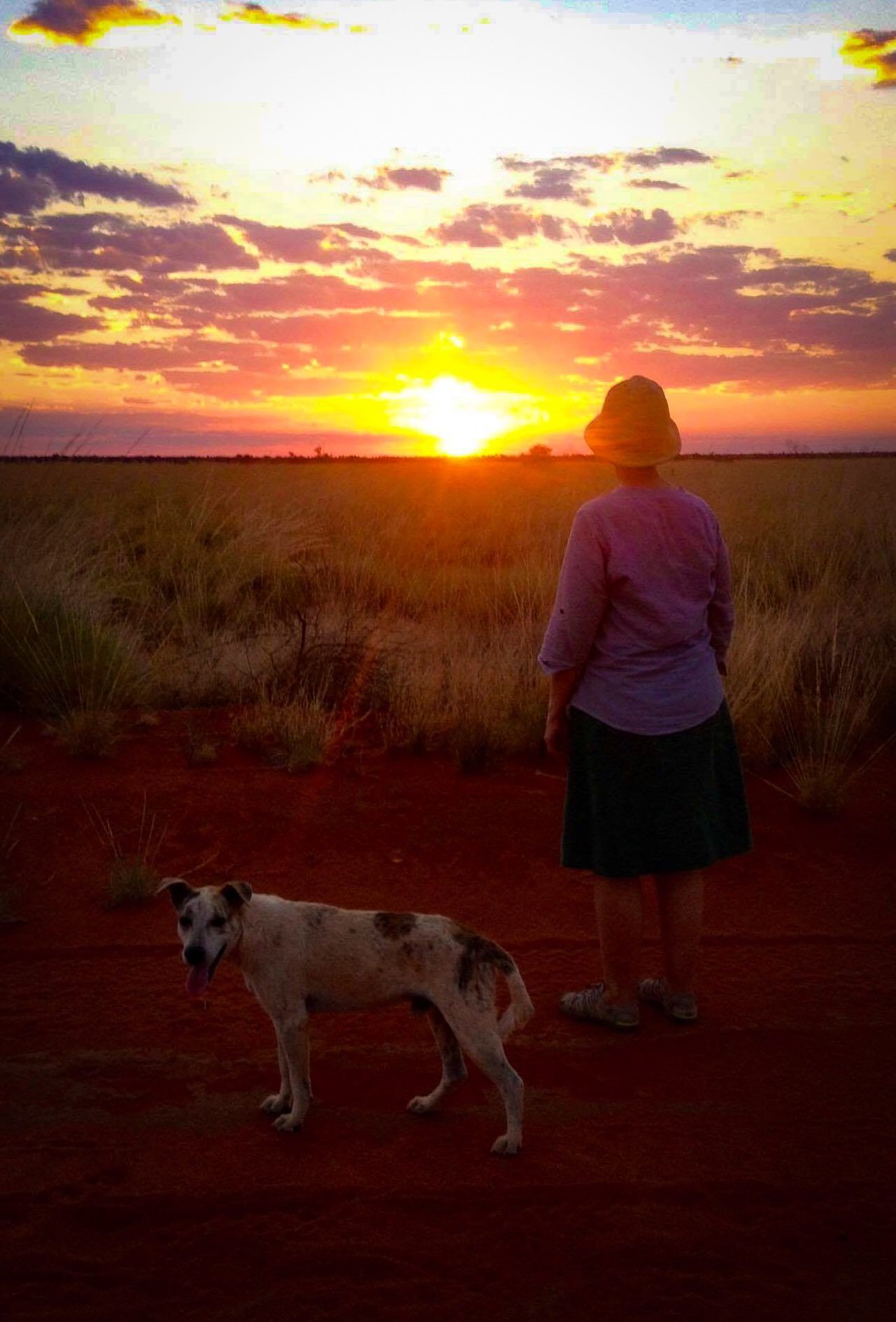 Juliet head teacher of JPP walking her dog at sunset
