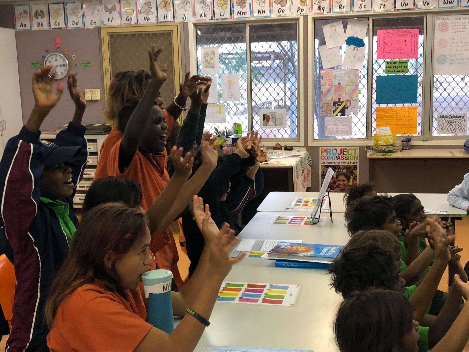 JPP Mulan students waving to penpals on video chat