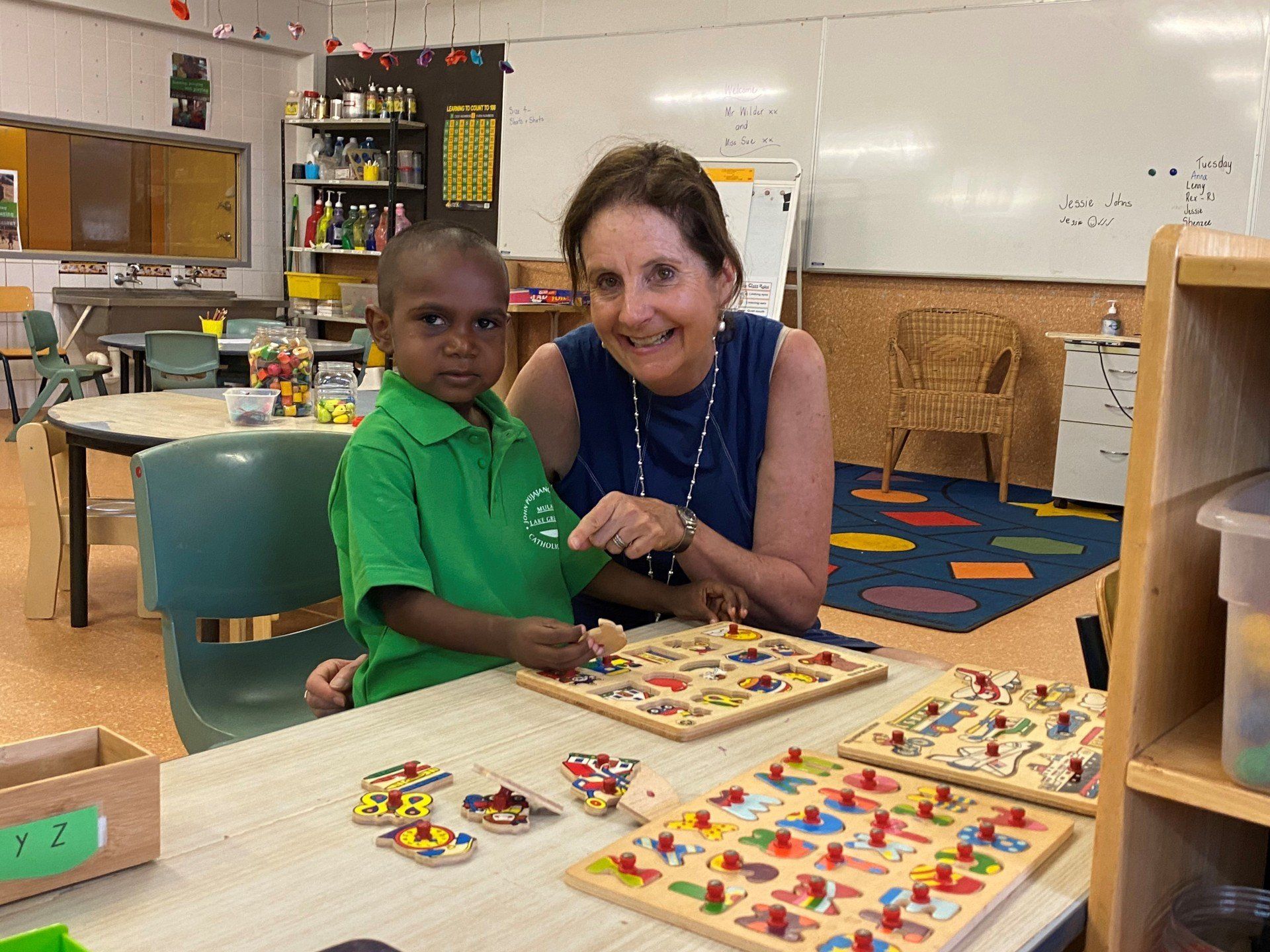 JPP Mulan teacher and student solving a puzzle