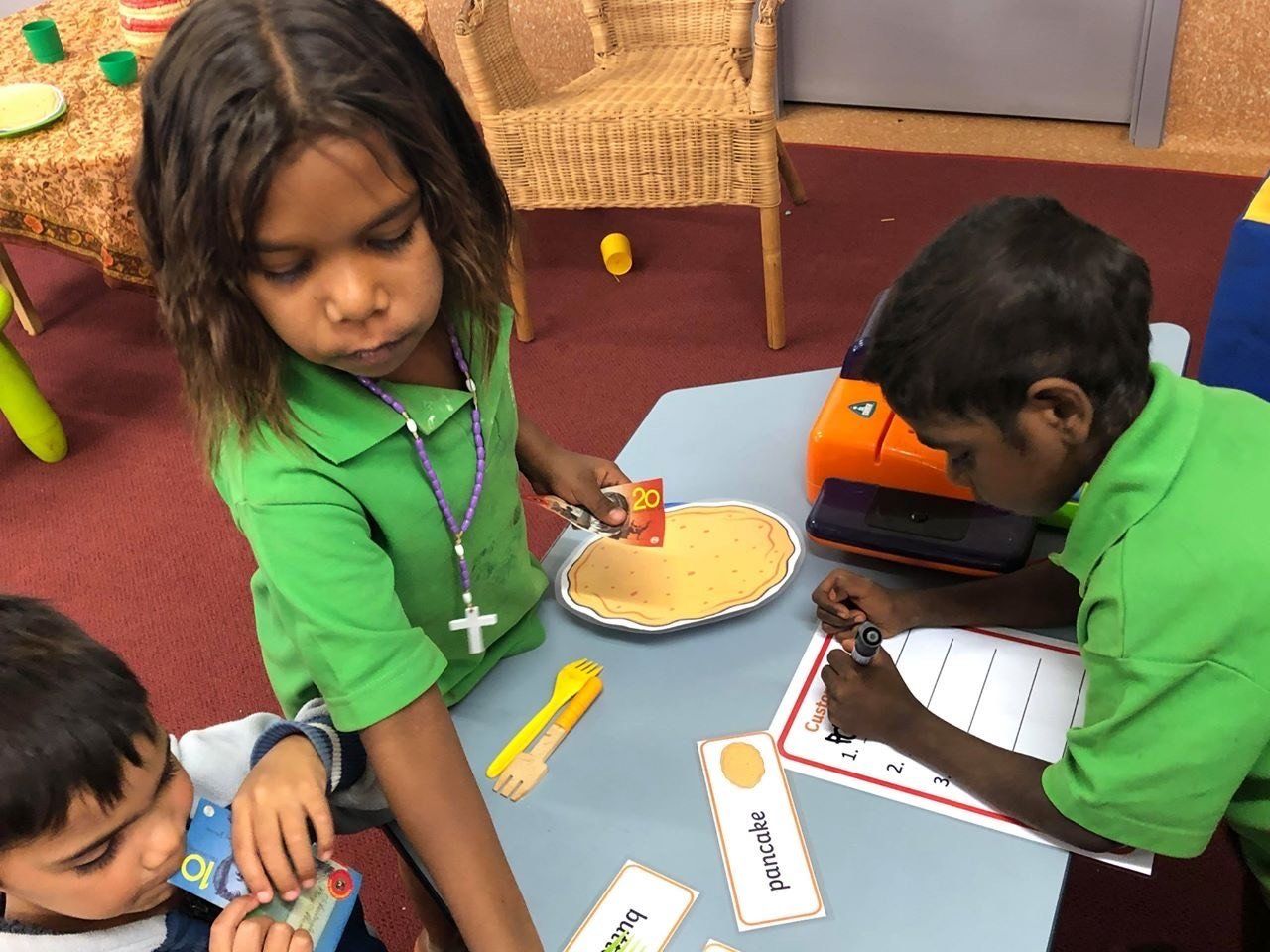 JPP Mulan students playing at their pancake cafe