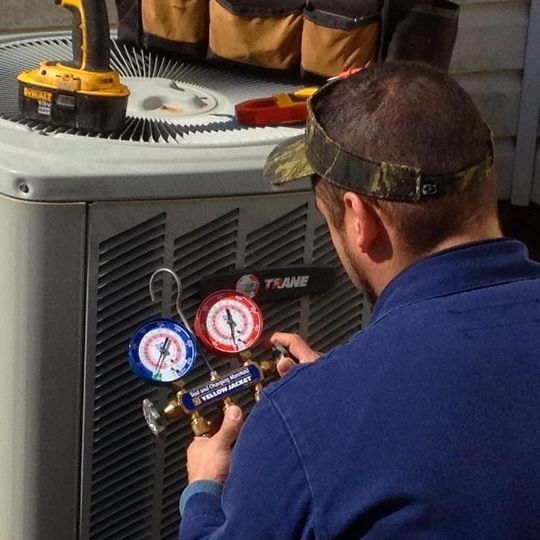 Air Conditioning Repair - Man Repairing a HVAC in Spartanburg, SC