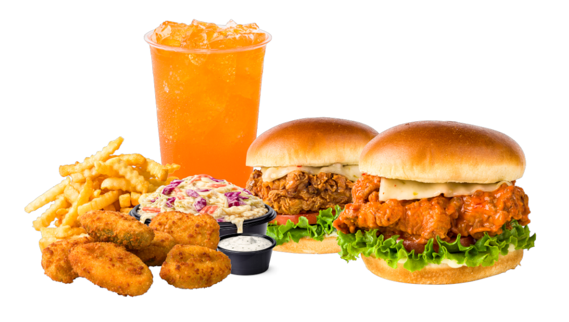A hamburger , chicken nuggets , french fries and a drink are on a table.