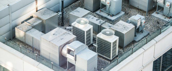 Air Conditioning Replacement — Air Conditioner Units on a Rooftop in Millersville, MD