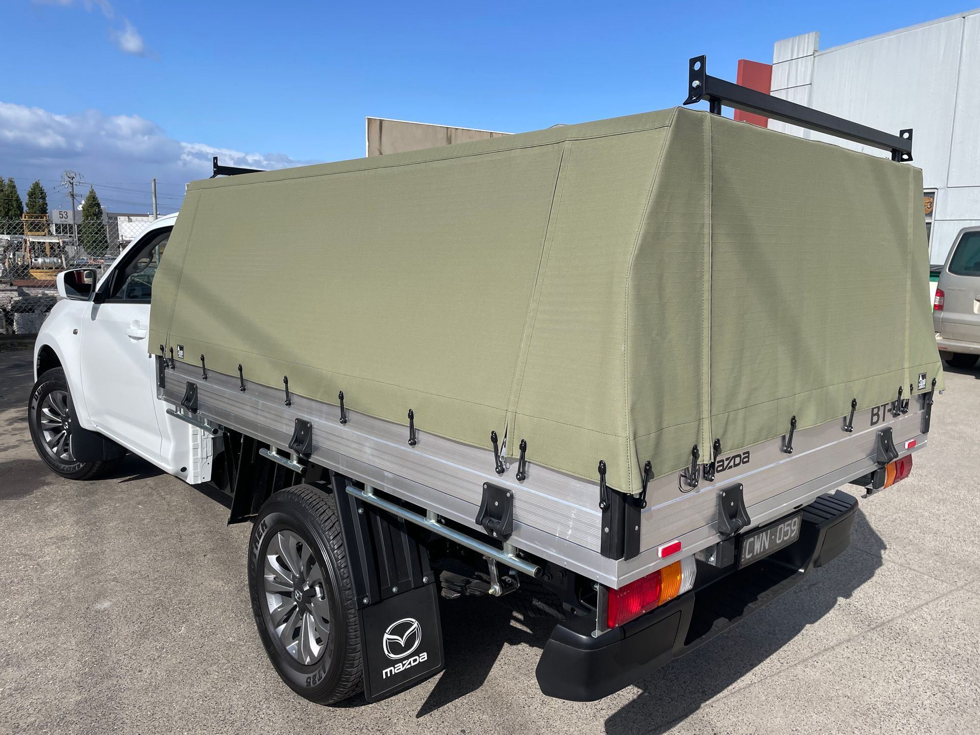2024 Mazda BT-50 khaki 16oz canvas tray canopy with carry bars
