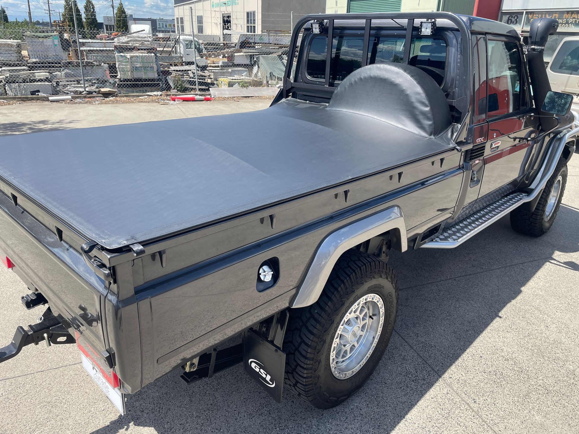 2010 Toyota Landcruiser Slikfit tonneau with tyre hood and 2 centre bars