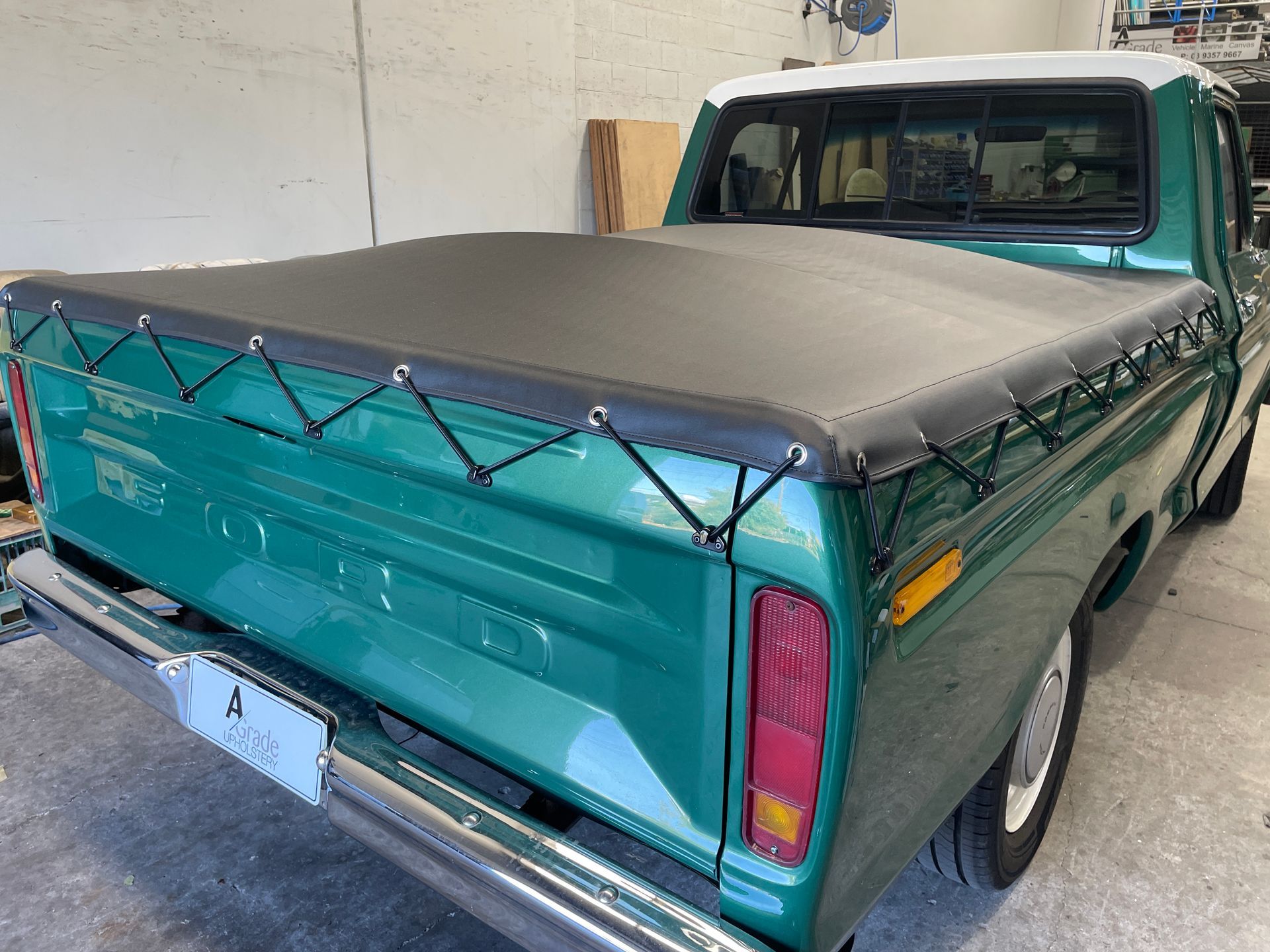 1977 Ford F100 black eyelet and elastic rope tonneau with triangle hooks and 2 centre bars