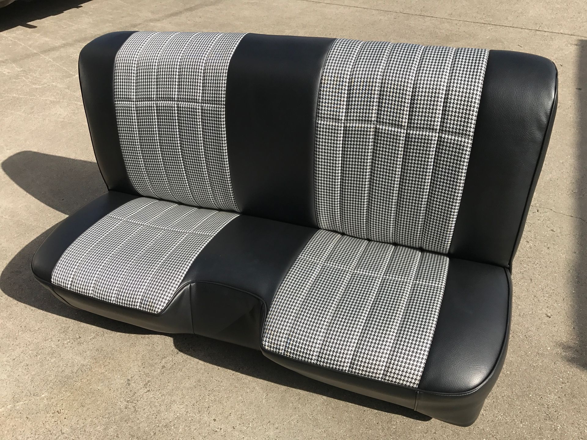 Black bench seat with houndstooth cloth inserts - front