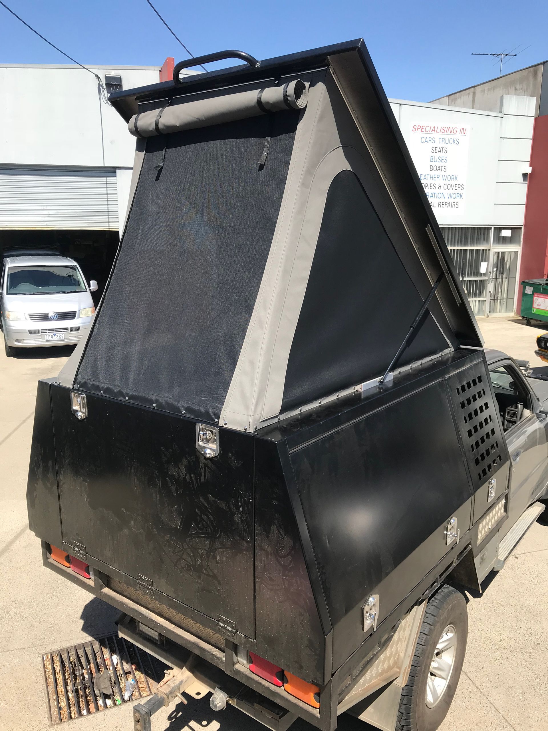 Canvas lift up tent with mesh windows on ute