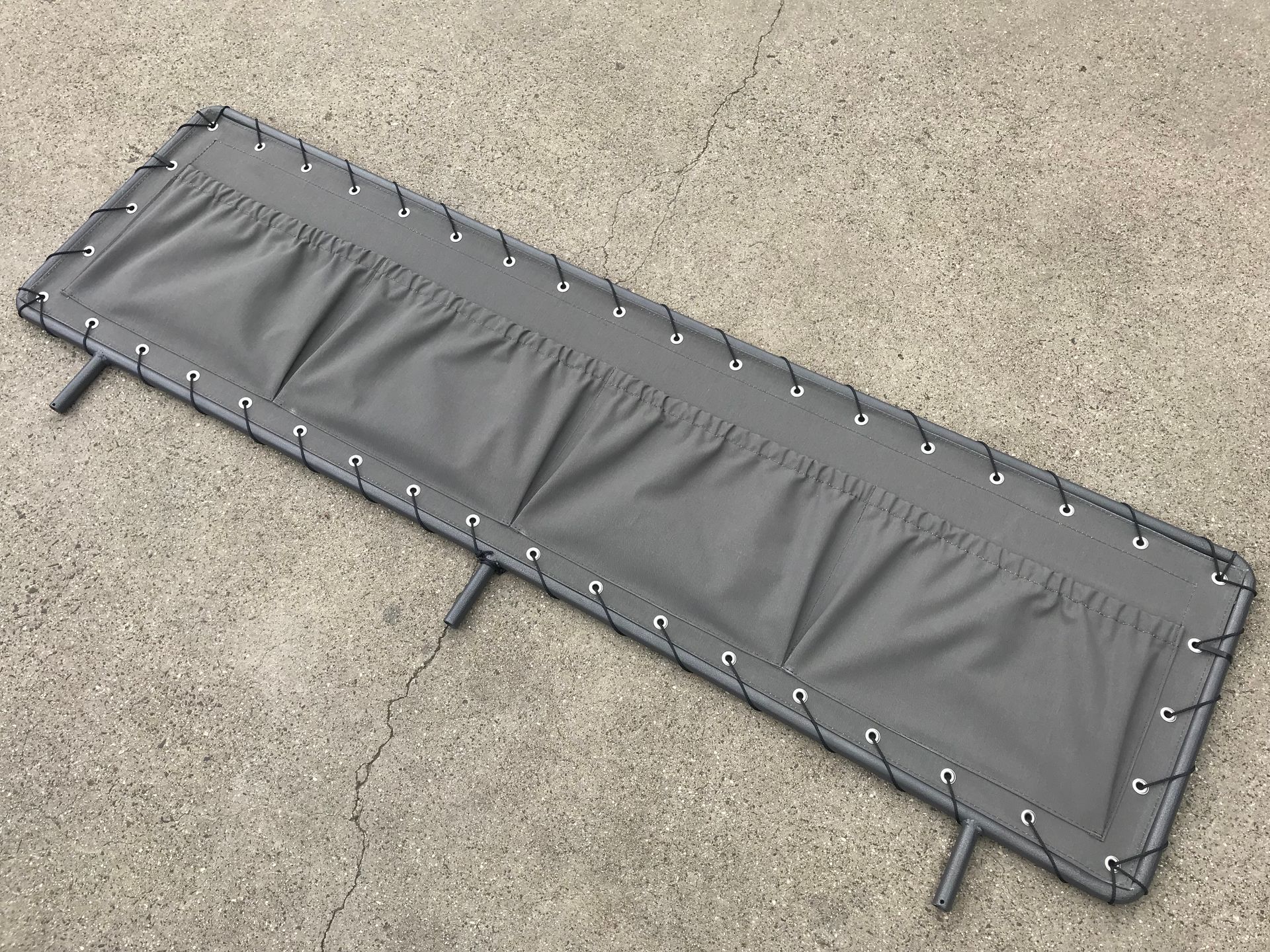 Canvas stone guard cover with 4 storage pockets on tubular frame