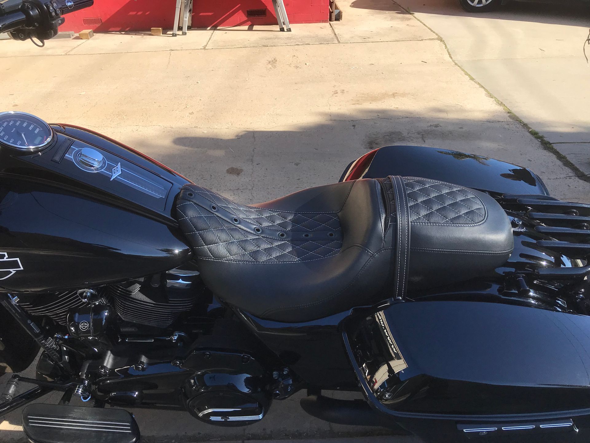 Cross stitch with eyelets custom black Harley seat installed