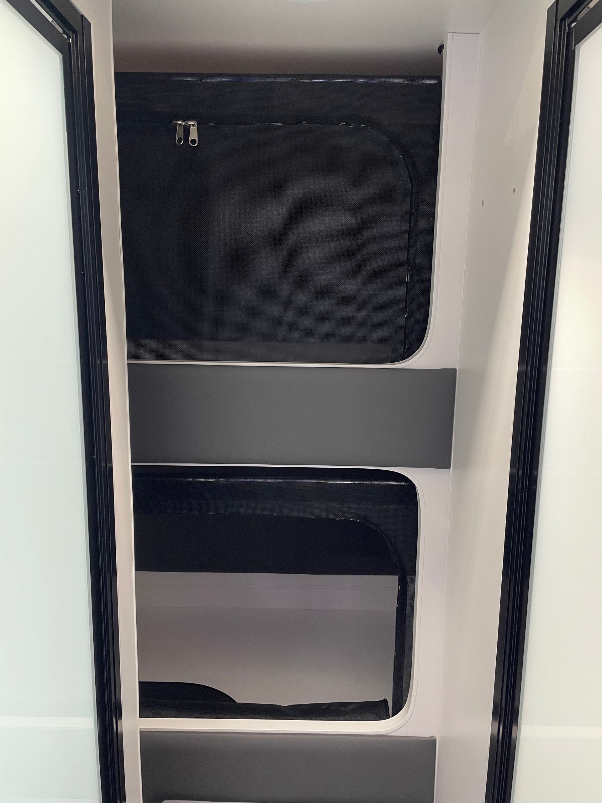 Double bunks with kid safe mesh screens with zip openings