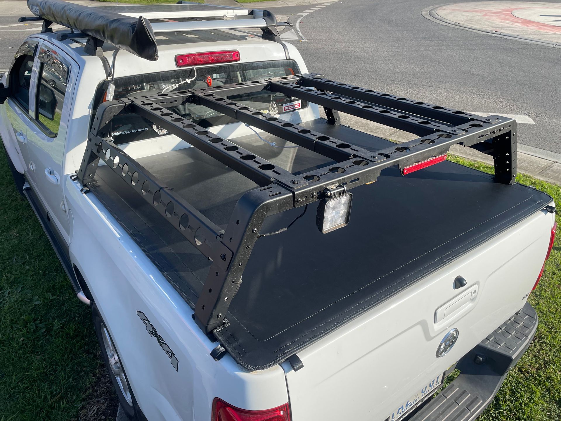 Holden Colorado 2013 custom push on tonneau around carry rack
