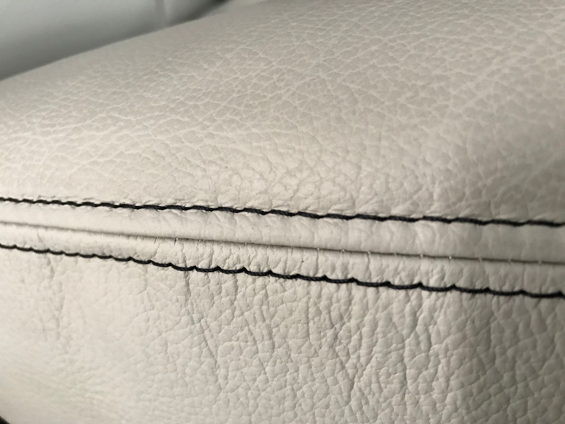 Motorhome lounge and dinette setting in cream leather