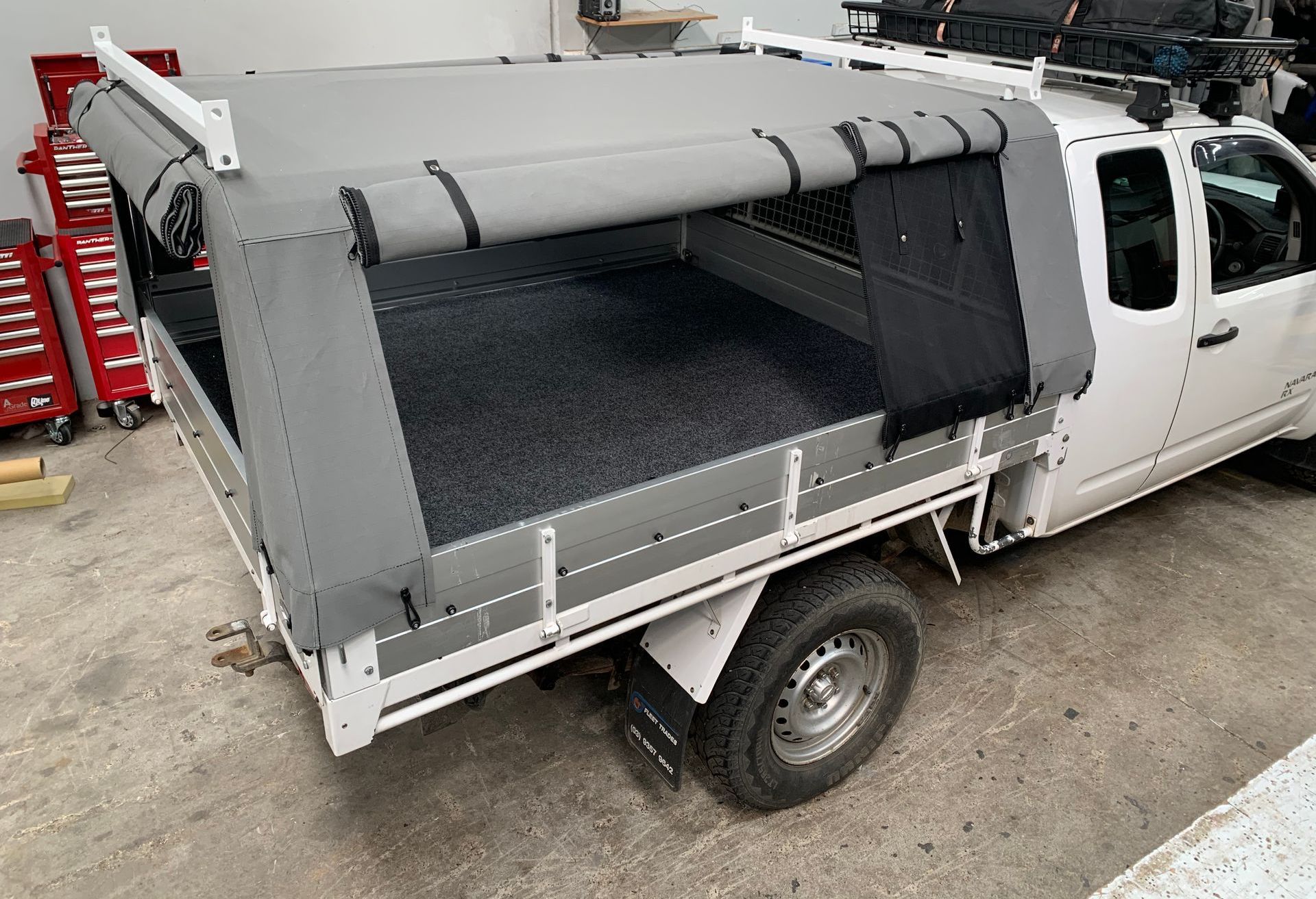 Navara RX canvas canopy with split side openings and mesh