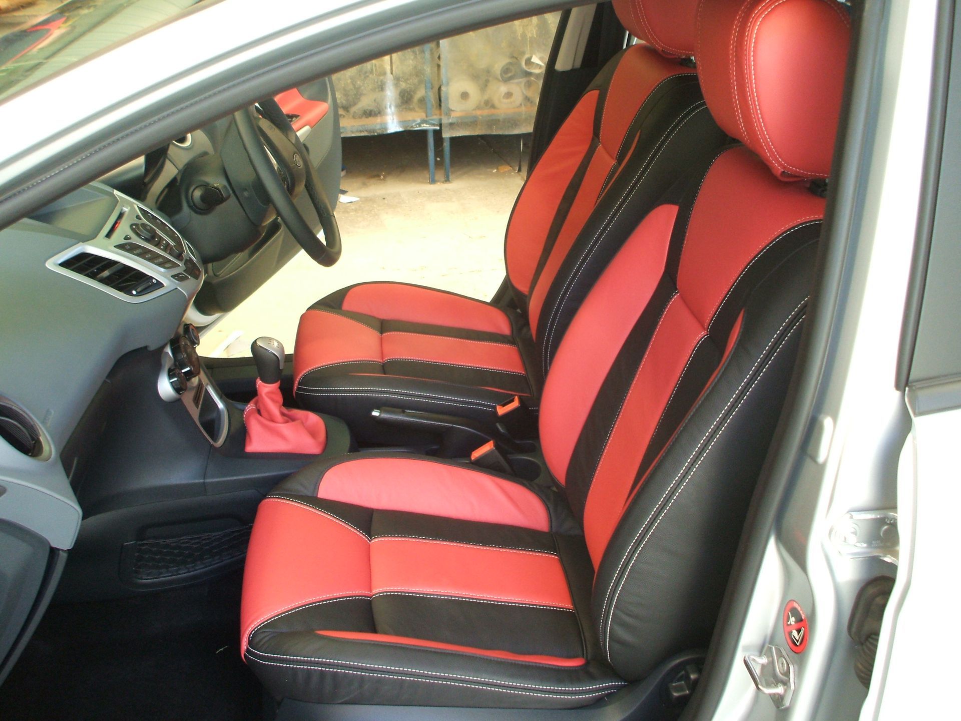 Red and black upholstered leather car interior