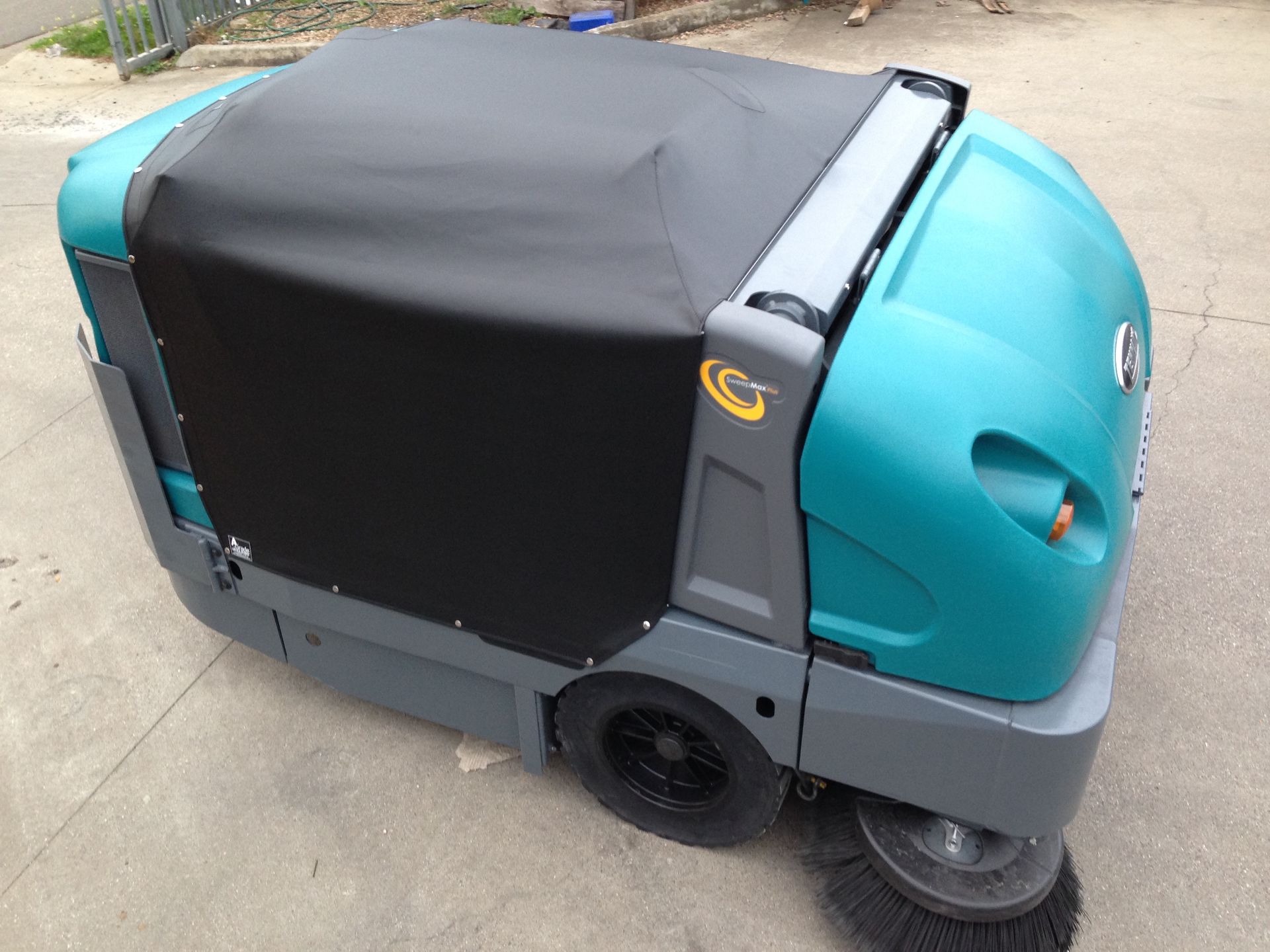 Tonneau cover on floor sweeper
