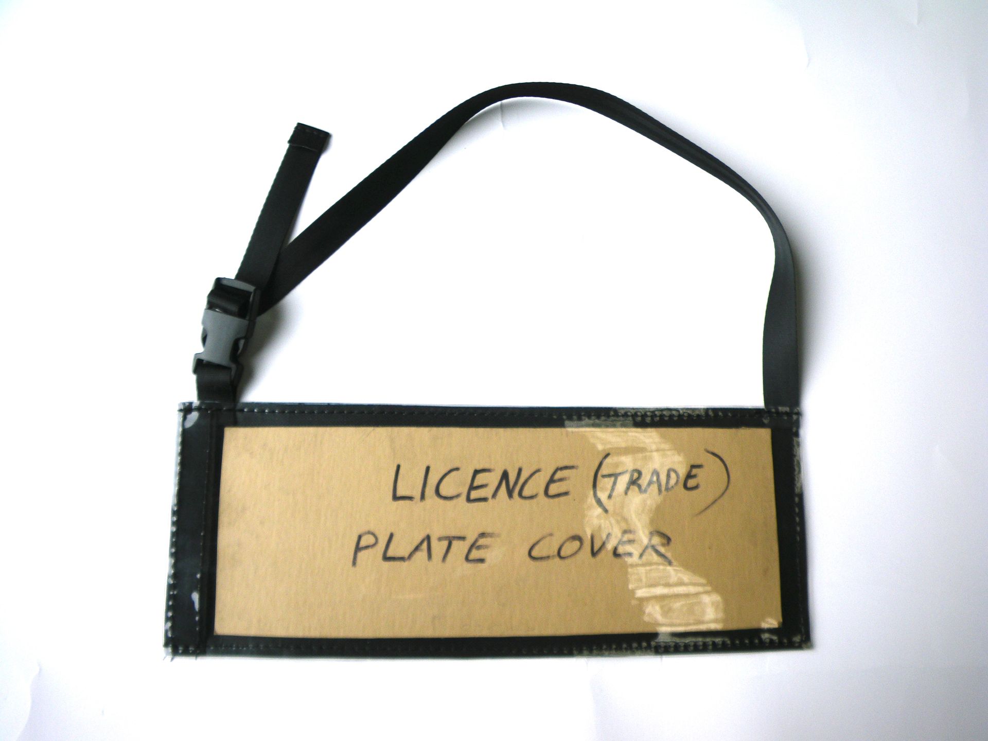 Trade plate cover single strap