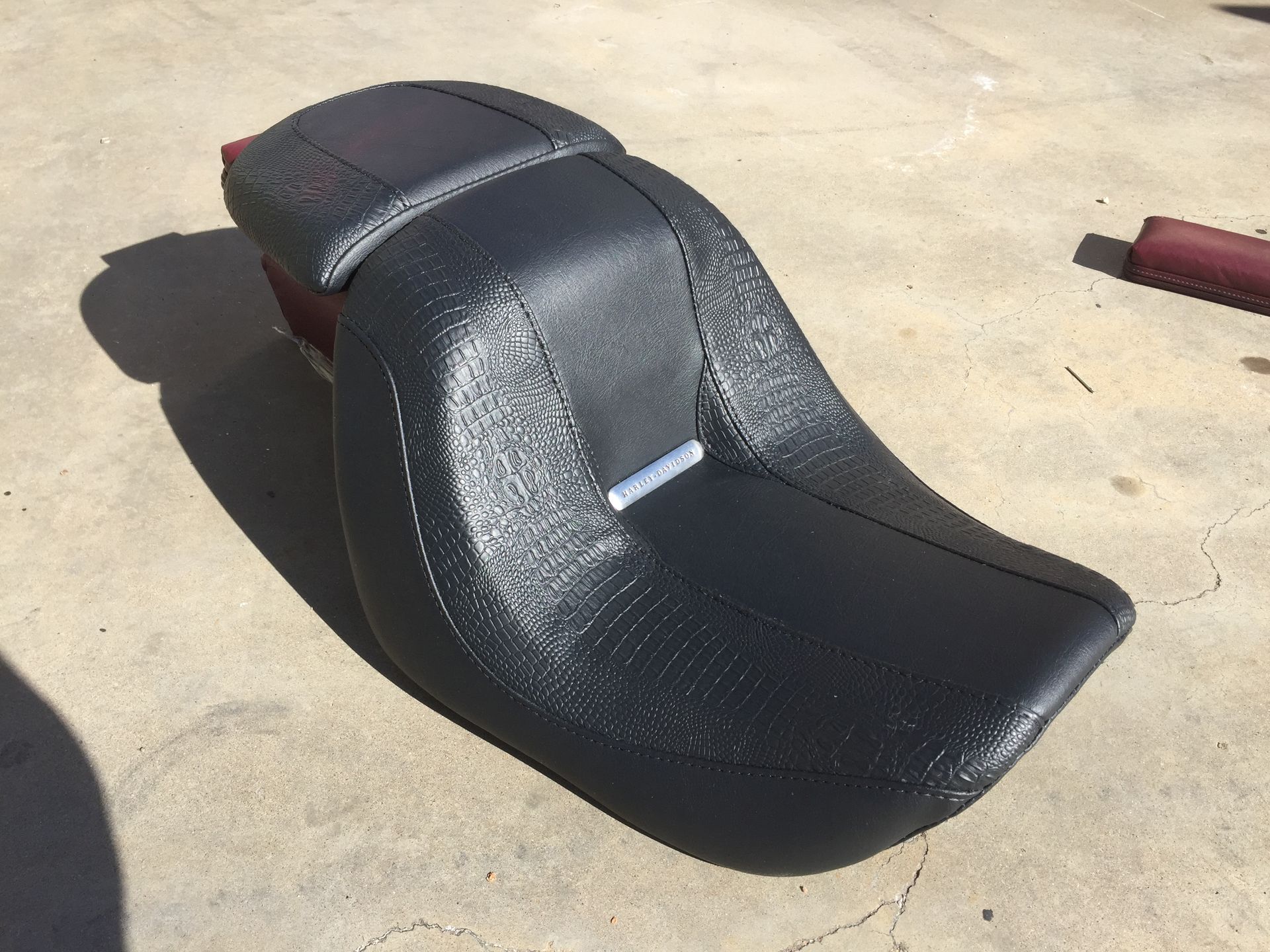 Two piece custom Harley seat with black plain and croc skin