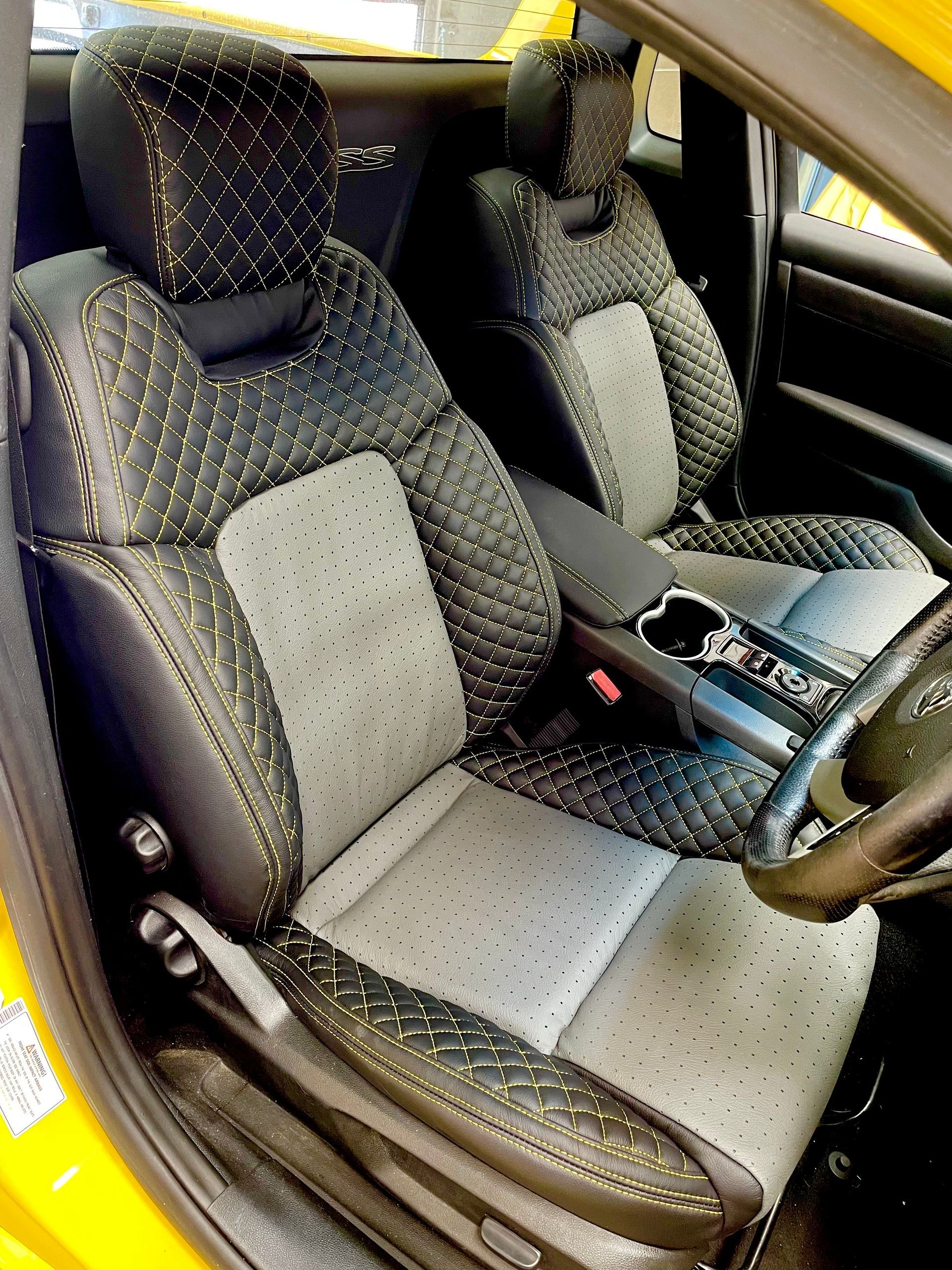 VE Commodore ute black and grey leather with yellow cross stitch driver seat