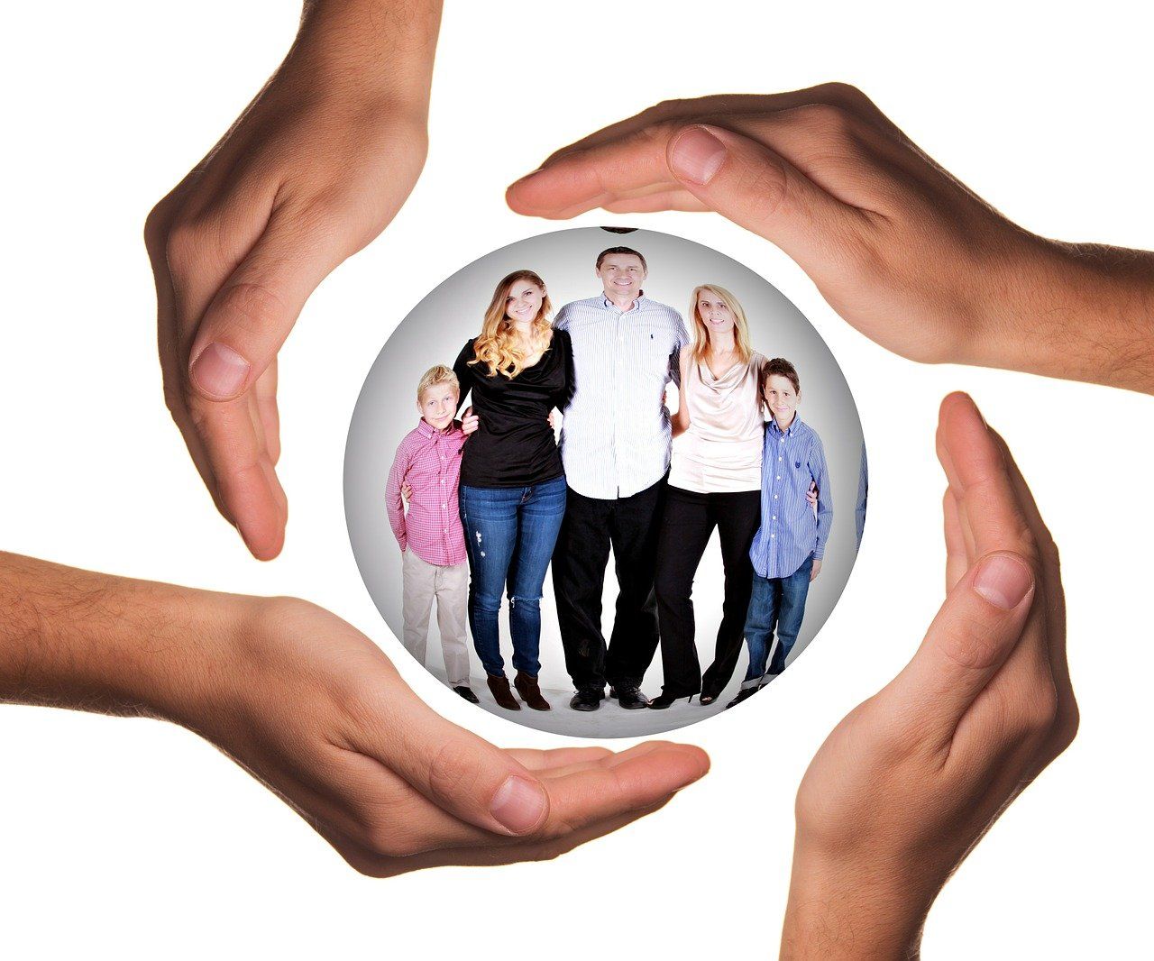 A group of hands are holding a picture of a family in a circle