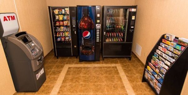 A room with vending machines and an atm machine