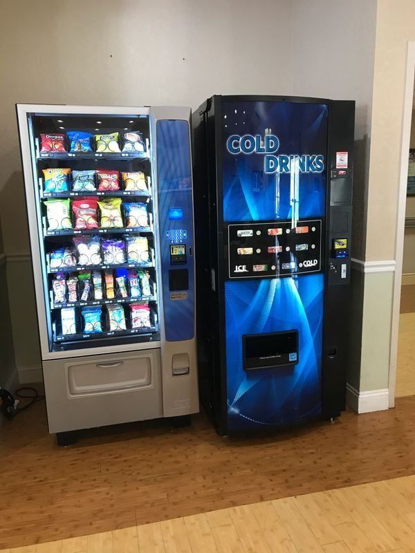 A vending machine that says cold drinks on it