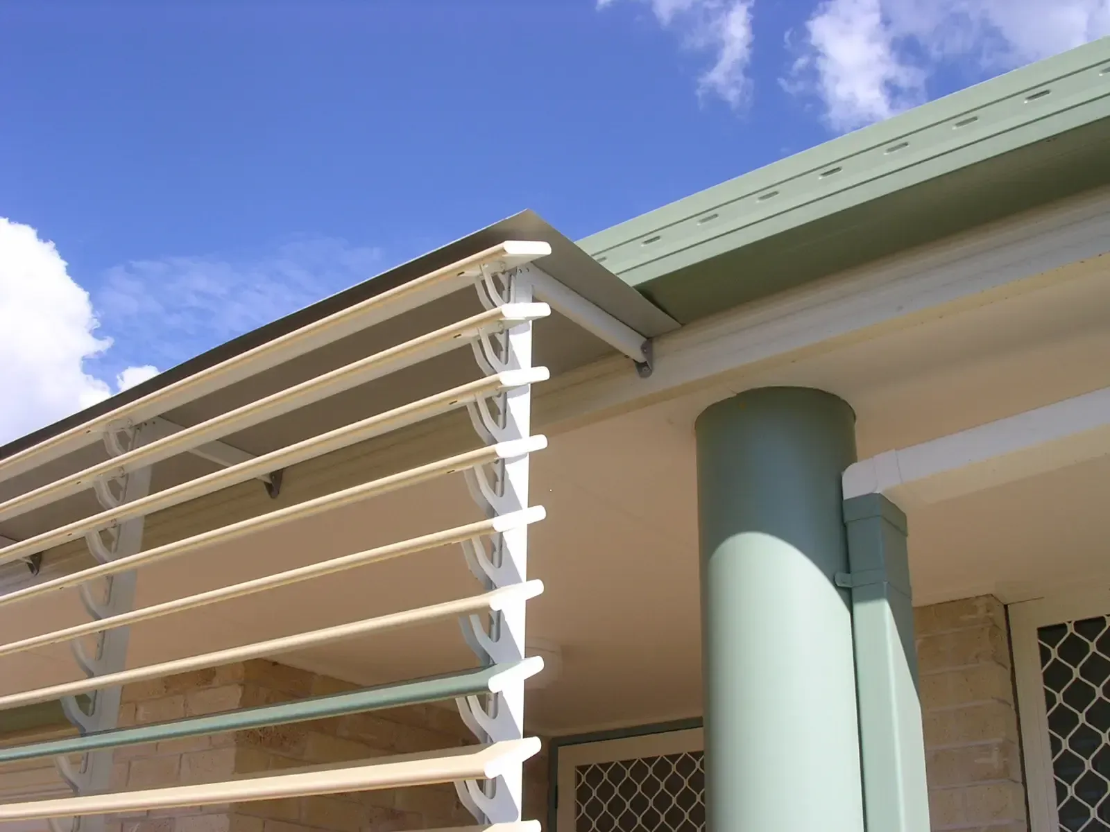 External Metal Slat Louvers Attached to the Side of a Building — Advantage Screen And Blinds Rockhampton in Rockhampton, QLD