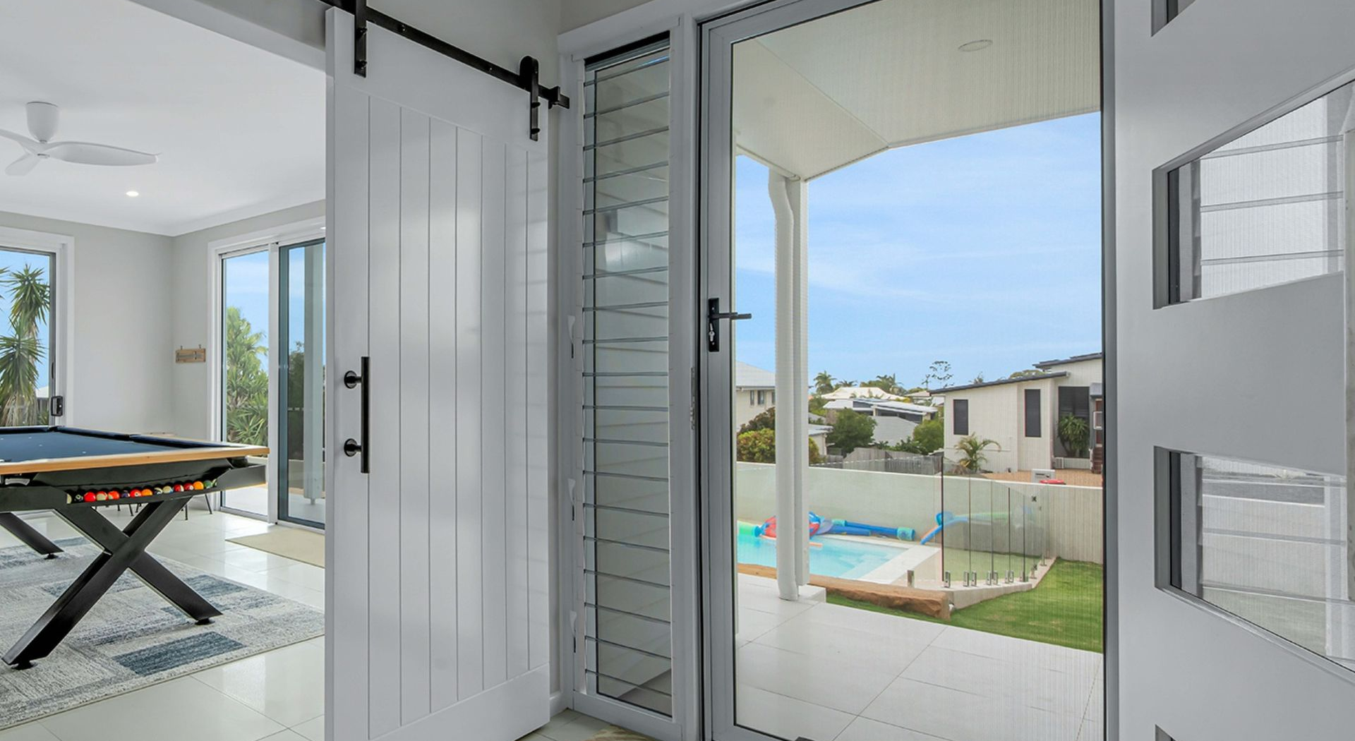 A White Door With a Clear Security Mesh Screen — Advantage Screen And Blinds Rockhampton in Gracemere, QLD