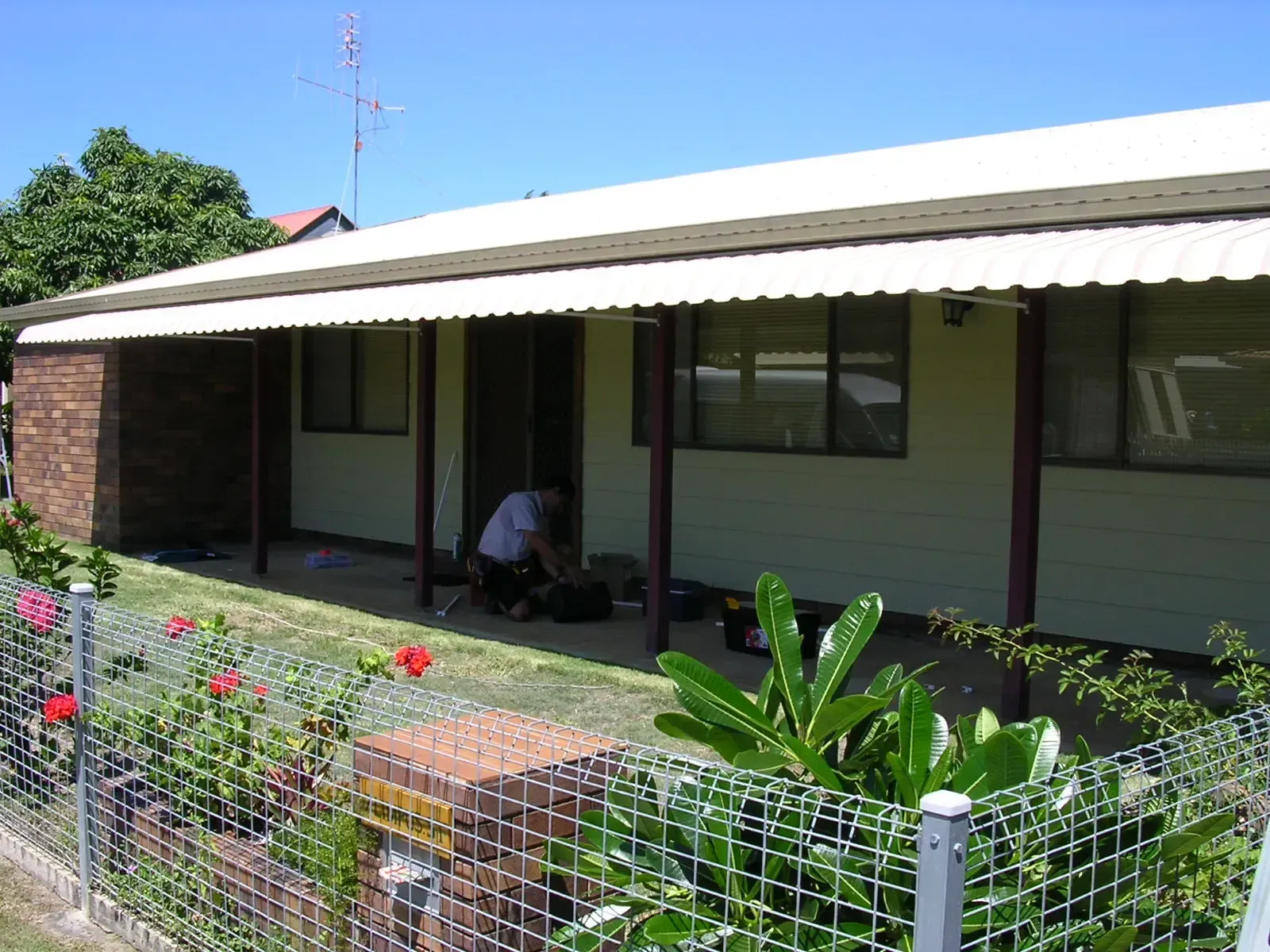 Single-story House With White Siding and a Corrugated Metal Roof — Advantage Screen And Blinds Rockhampton in Rockhampton, QLD