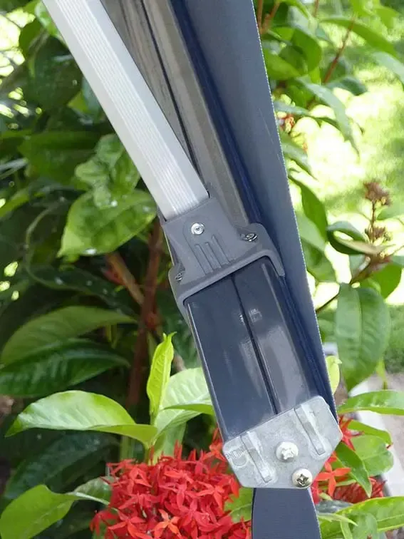 A Close-up of a Plastic Umbrella Bracket Connector Attached to a Metal Frame — Advantage Screen And Blinds Rockhampton in Rockhampton, QLD