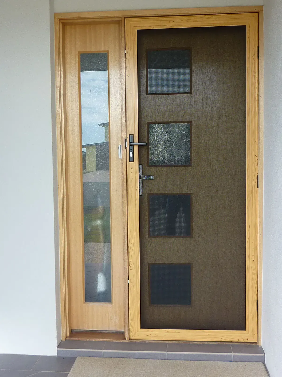 A Wooden Door With a Narrow Frosted Glass Panel — Advantage Screen And Blinds Rockhampton in Rockhampton, QLD