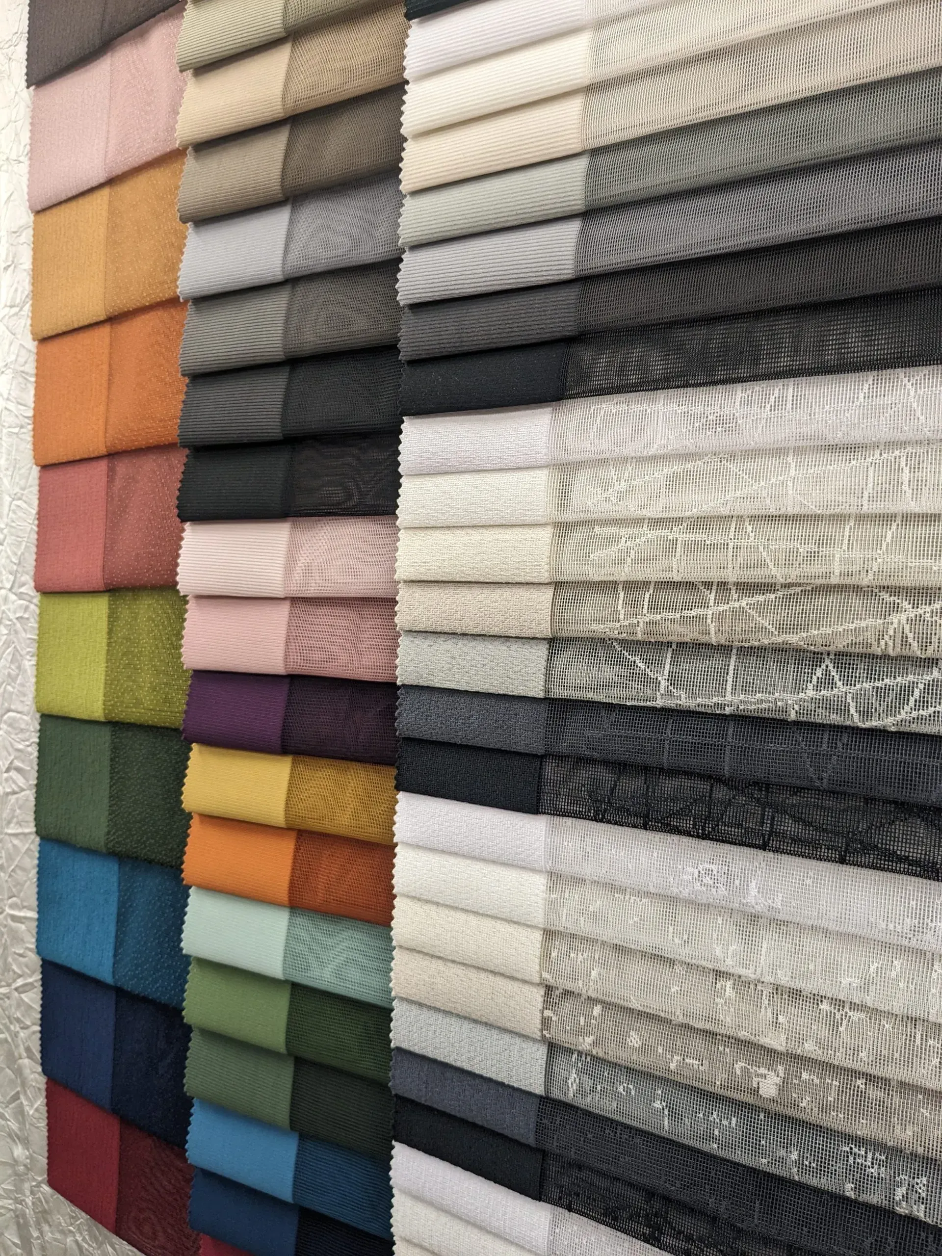 A Fabric Swatch Display Featuring Various Textures and a Wide Palette of Colors — Advantage Screen And Blinds Rockhampton in Rockhampton, QLD