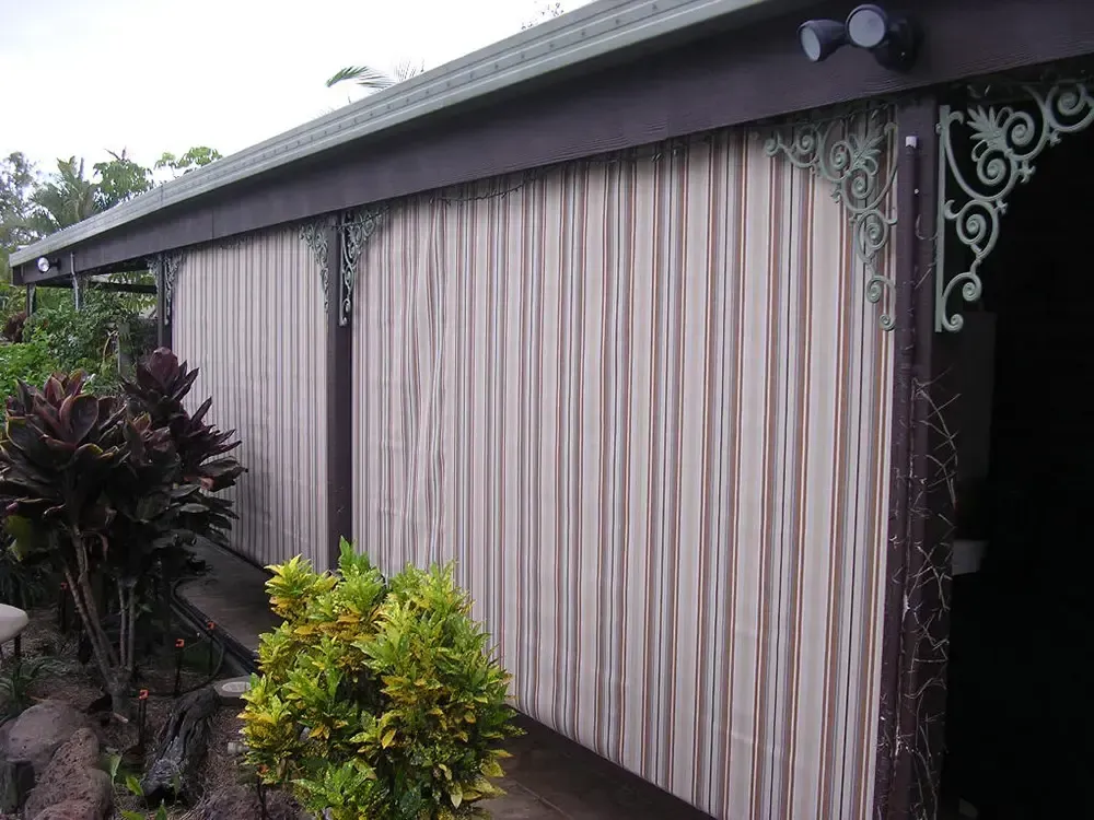 A Patio Covered With Light-colored, Striped Vertical Fabric Blinds — Advantage Screen And Blinds Rockhampton in Rockhampton, QLD