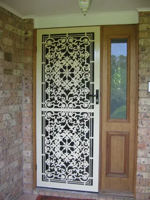 Decorative Screen Door With an Ornate Scrollwork Pattern — Advantage Screen And Blinds Rockhampton in Rockhampton, QLD