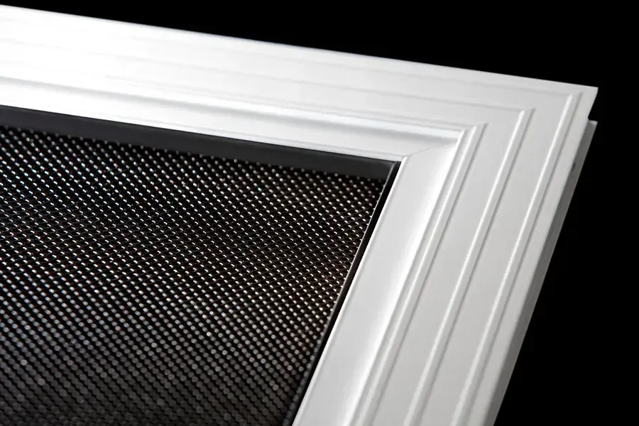 A White Frame Corner With a Dark Mesh Pattern — Advantage Screen And Blinds Rockhampton in Rockhampton, QLD