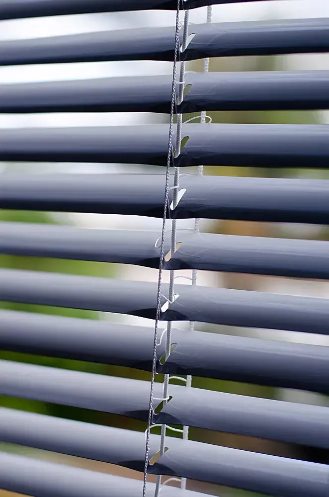 Close-up of Blue Horizontal Window Blinds Slightly Open — Advantage Screen And Blinds Rockhampton in Rockhampton, QLD