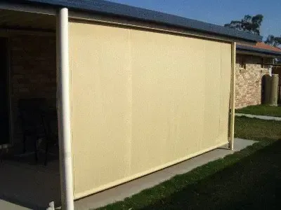 A Light Beige Outdoor Privacy Blind Installed on a Covered Patio — Advantage Screen And Blinds Rockhampton in Rockhampton, QLD