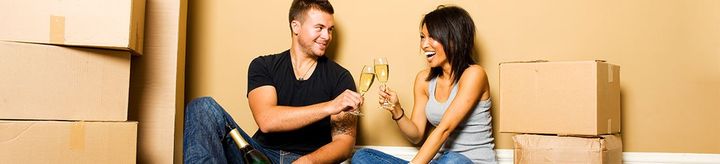 couple toasting in new home